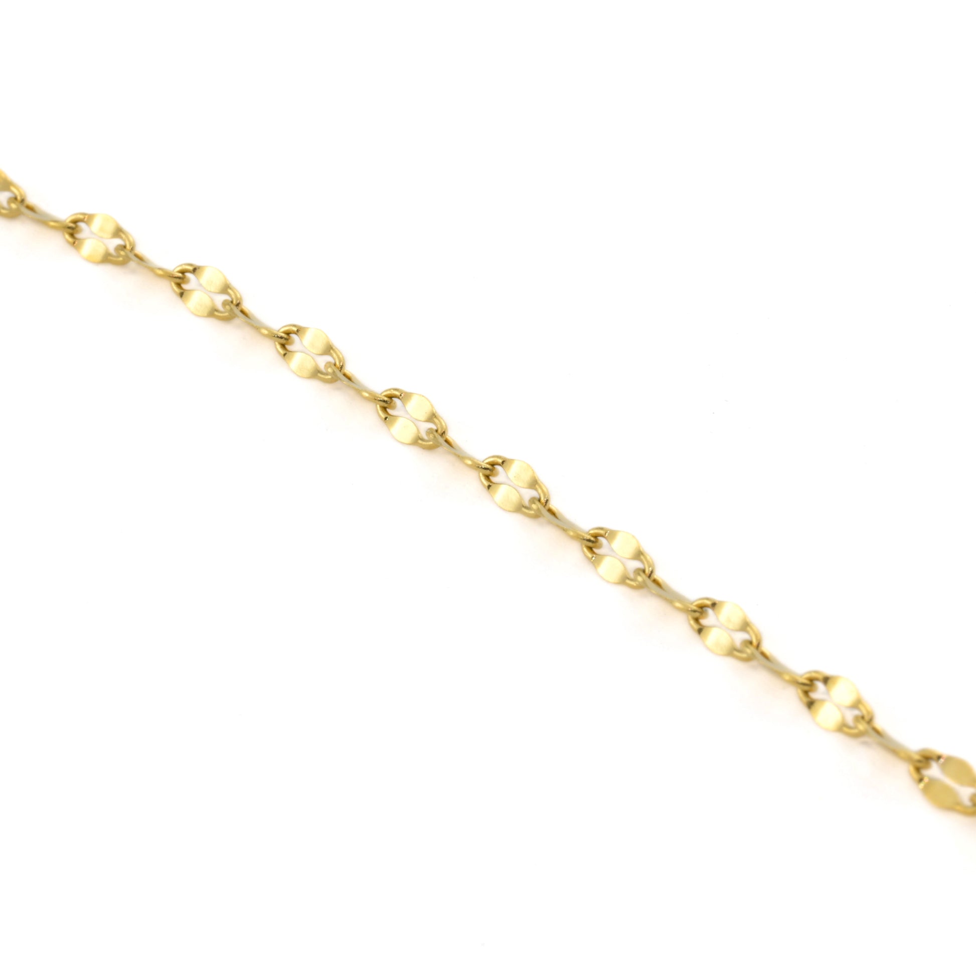 Gold chain anklet on a white background 