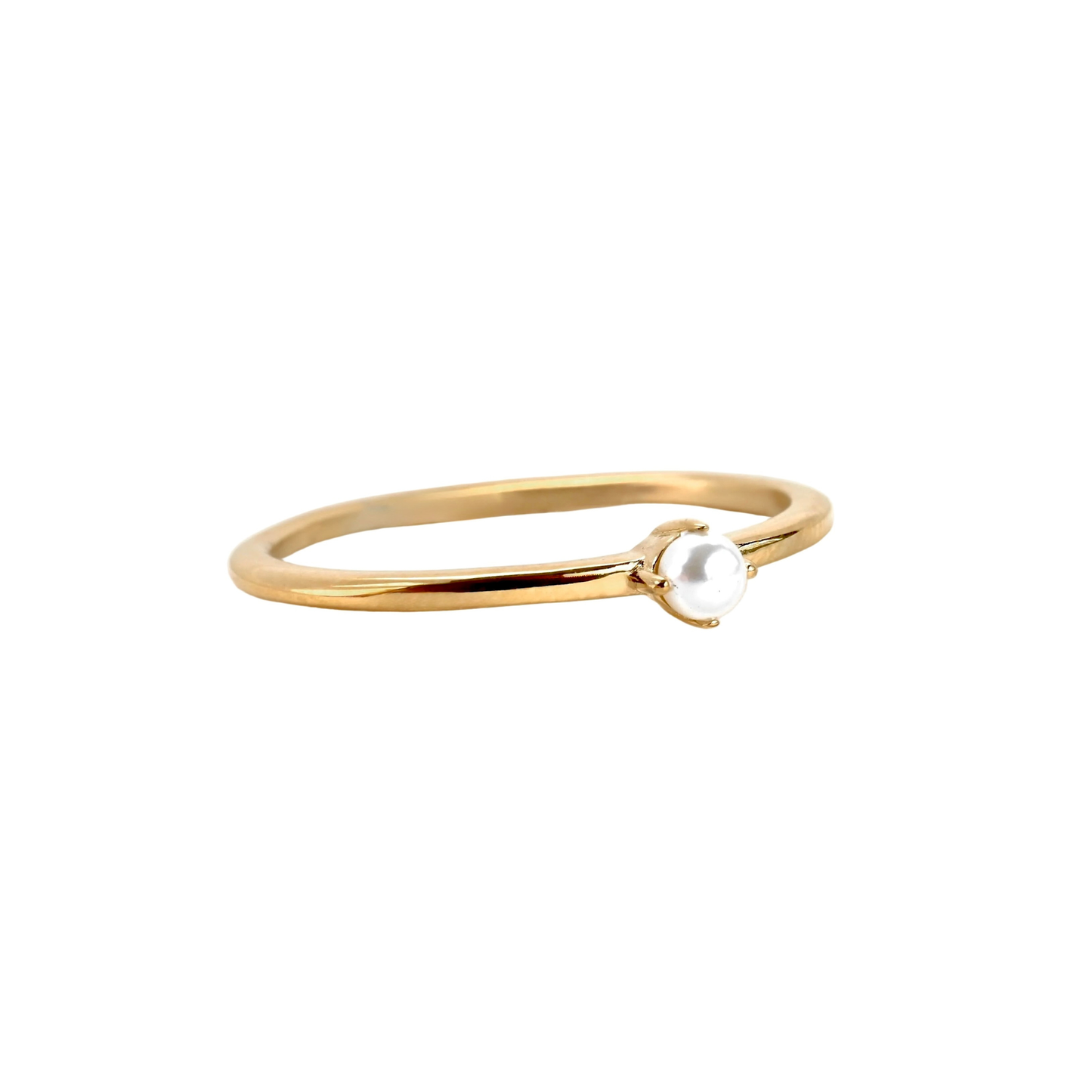 Gold ring with a small pearl on a white background