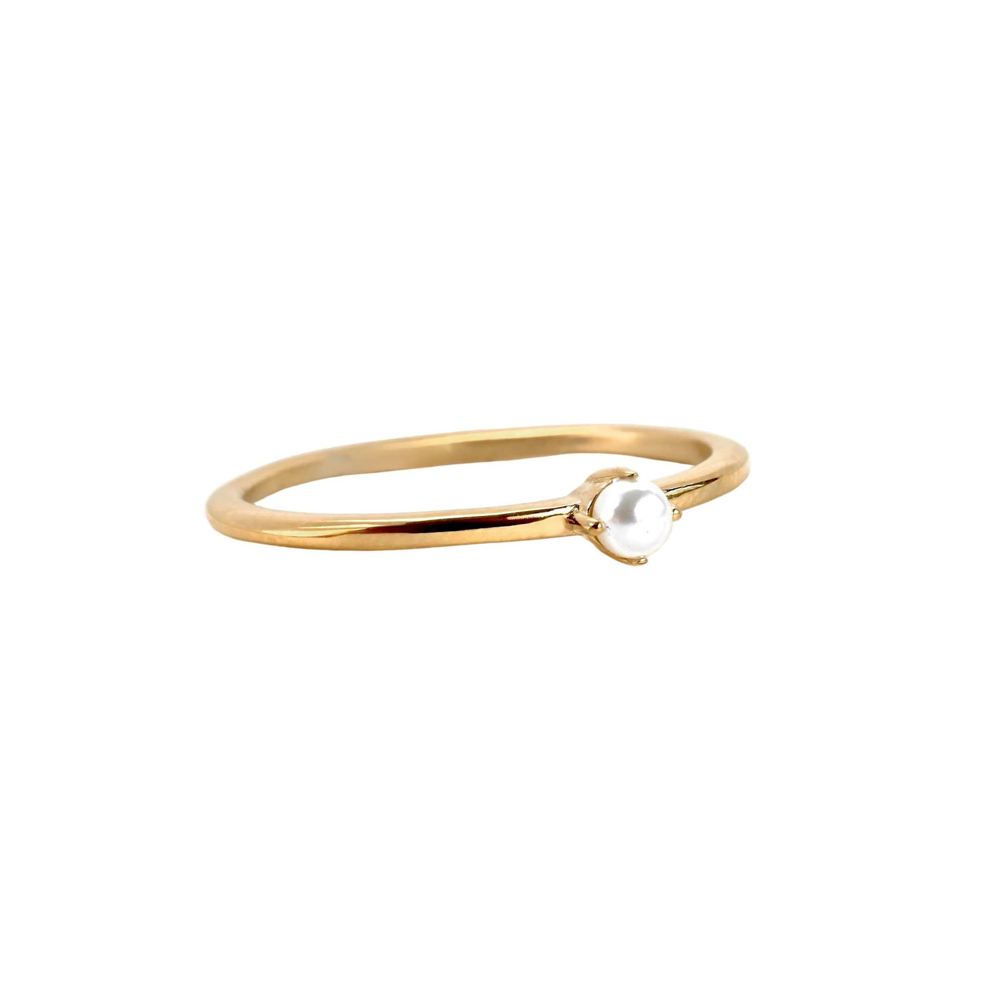 Gold ring with a small pearl on a white background
