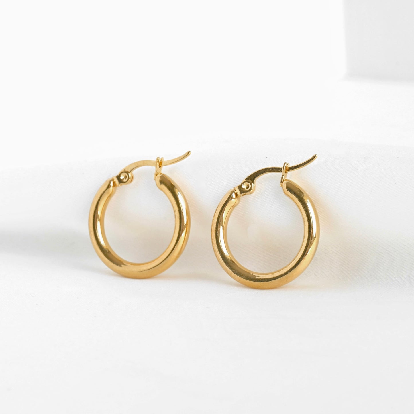 20mm thick gold hoops on a white background