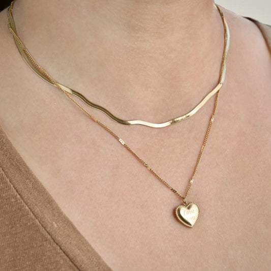 Layered herringbone chain and love you engraved heart pendant on a sparkly curb chain