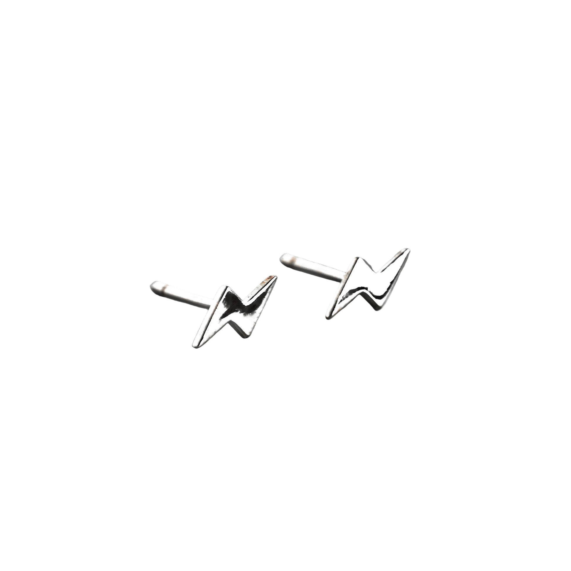 Pair of silver thunder stud earrings on a white background