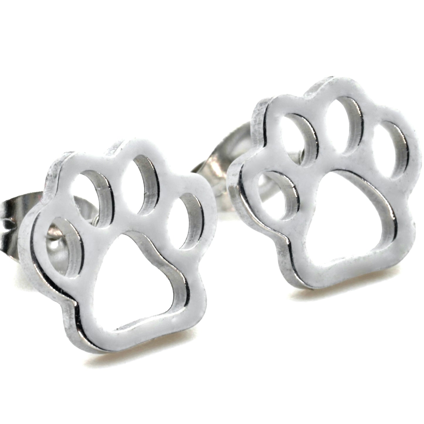 Close-up view of silver paw earrings on a white background