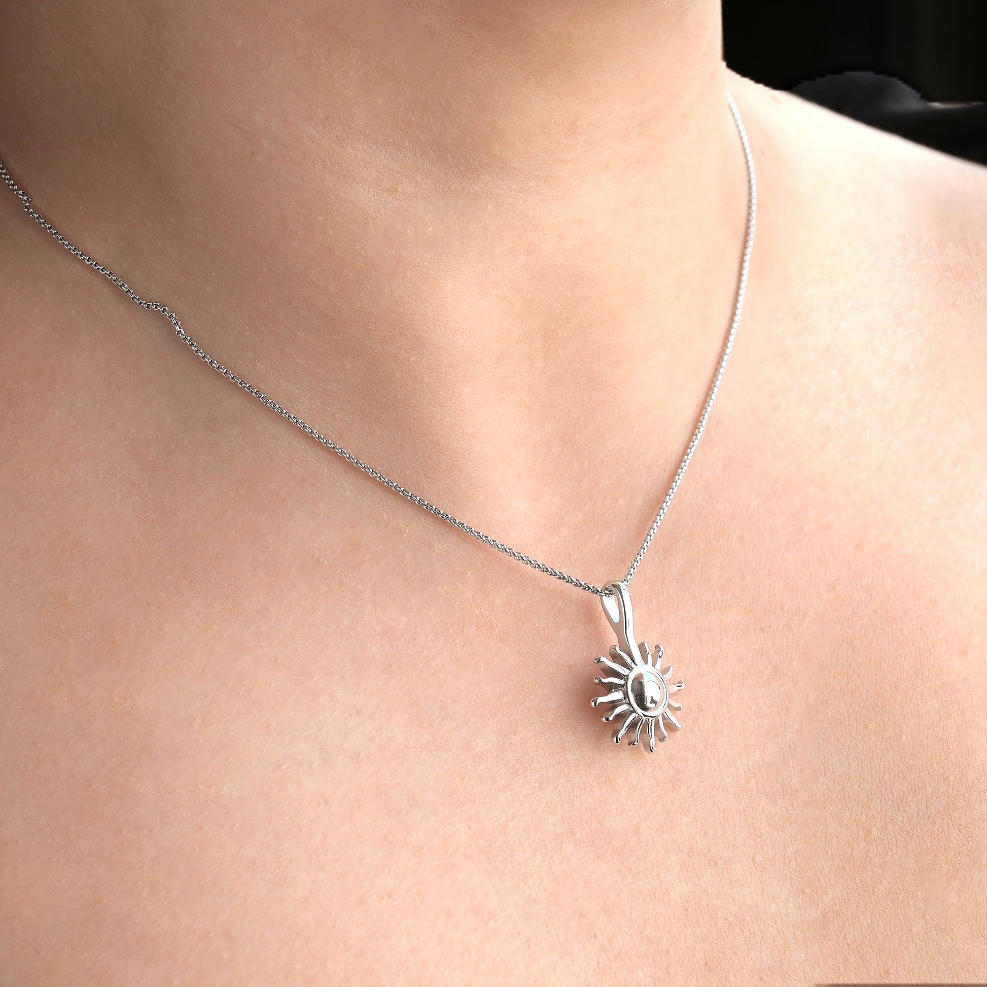 angled view of the Silver necklace on a person's neck