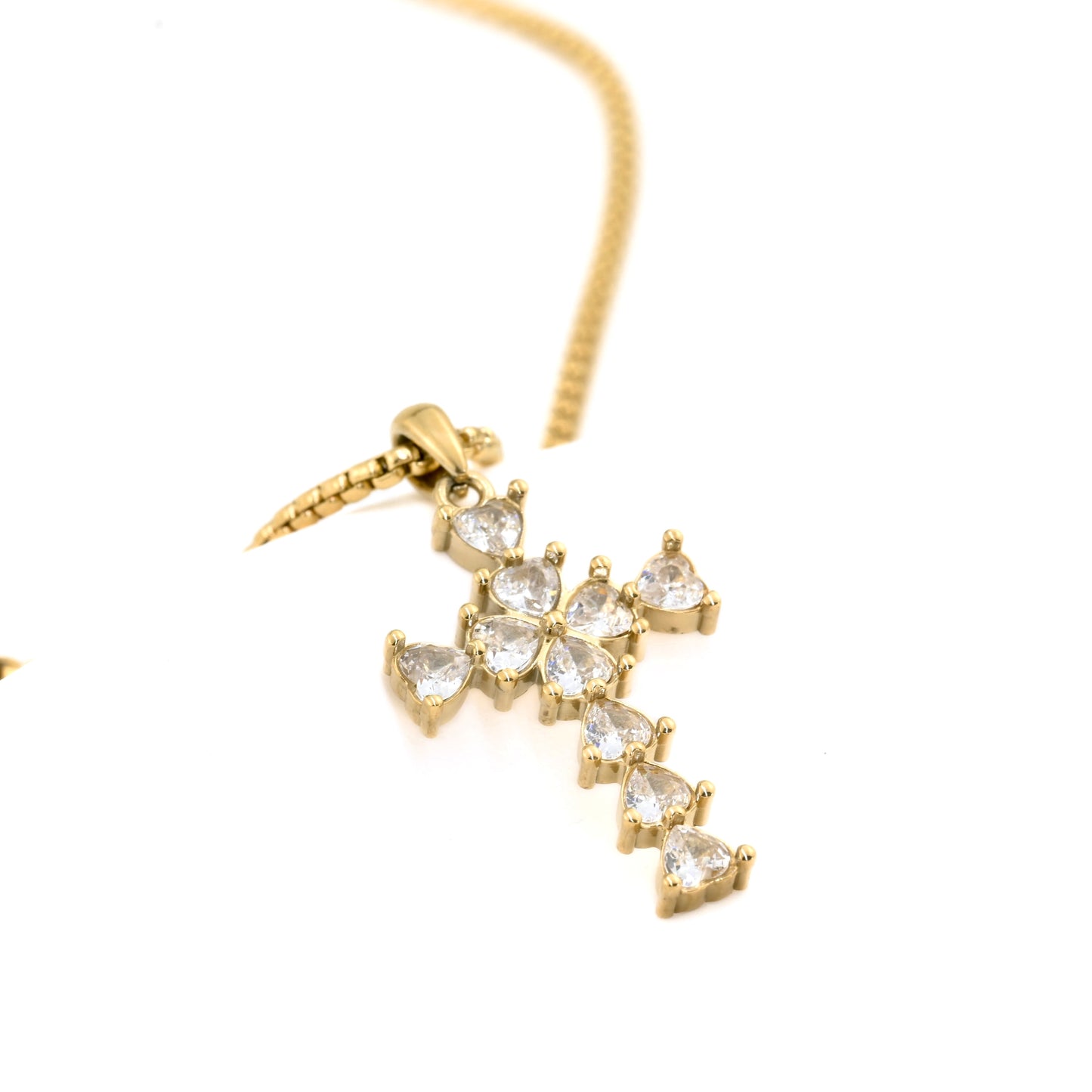 close-up view of the gold cross pendant