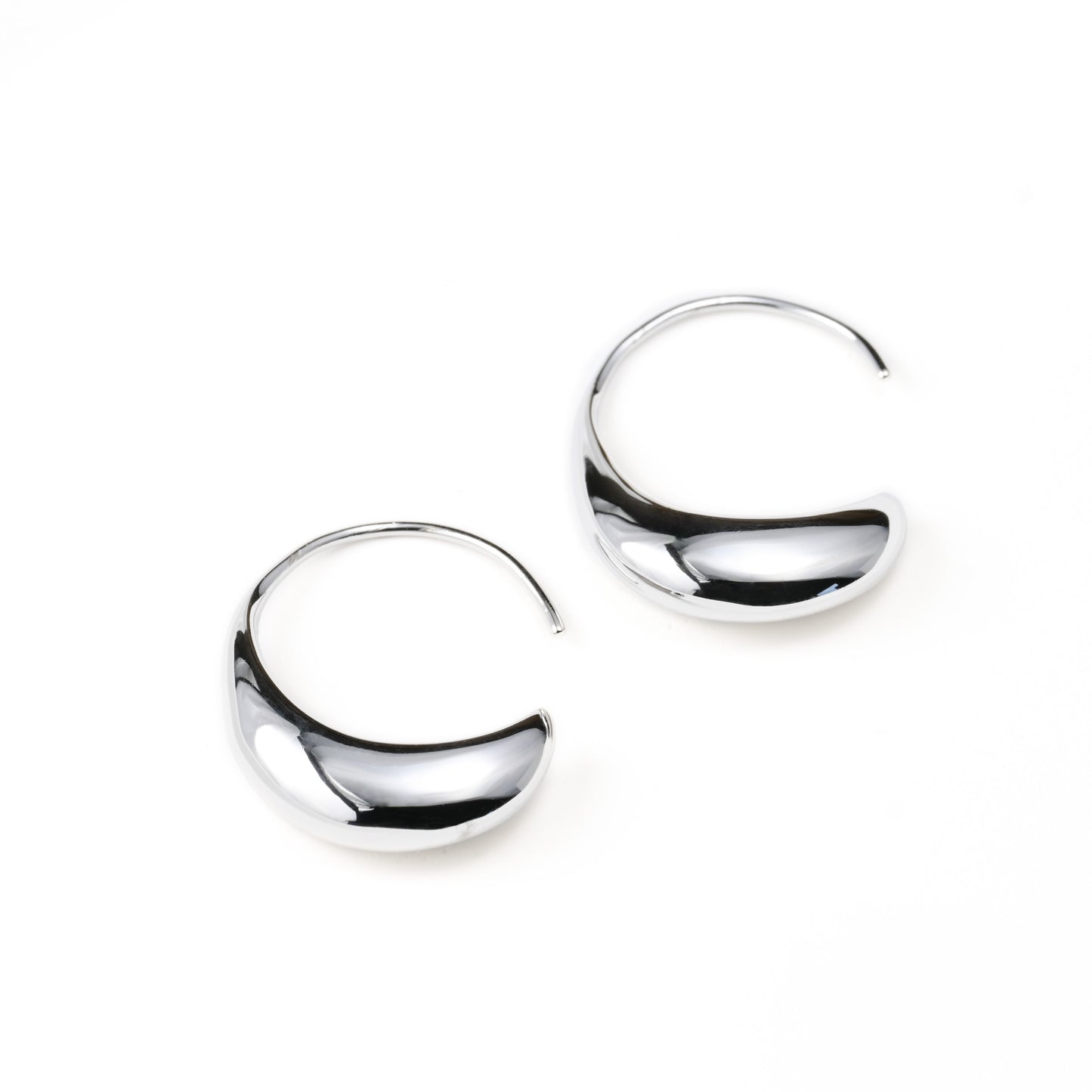 Pair of silver hook earrings on a white background