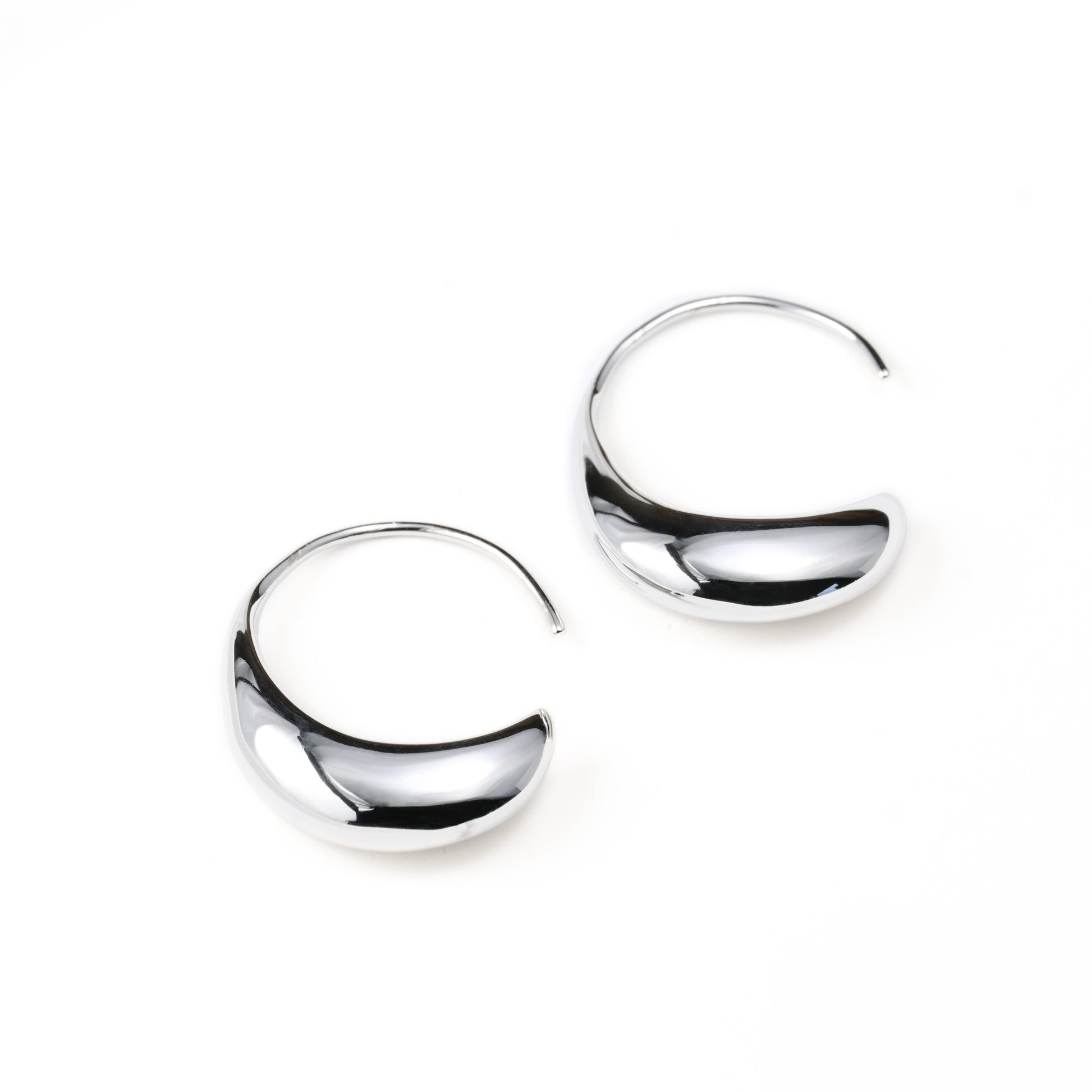 Pair of silver hook earrings on a white background
