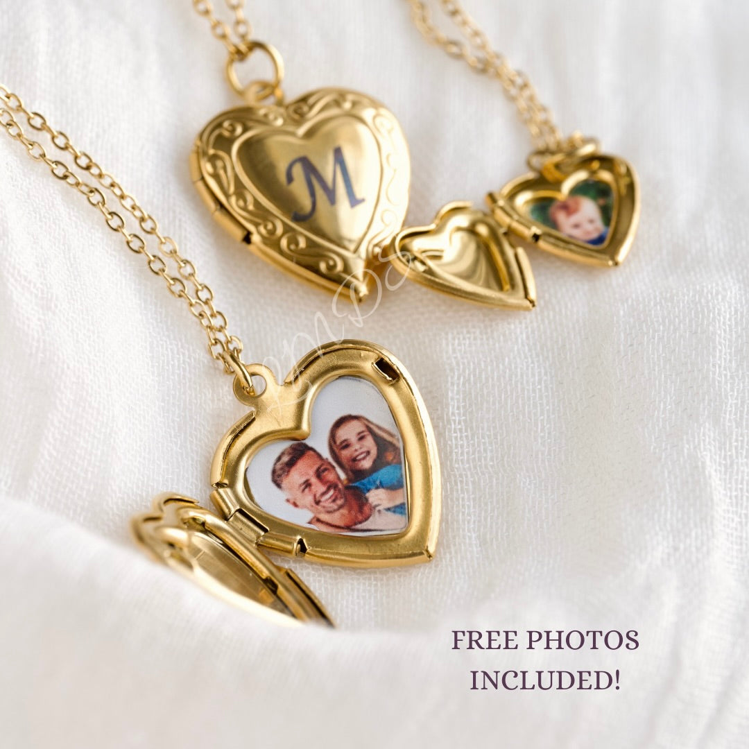 Gold heart locket with engraved initials and family photos on a white background