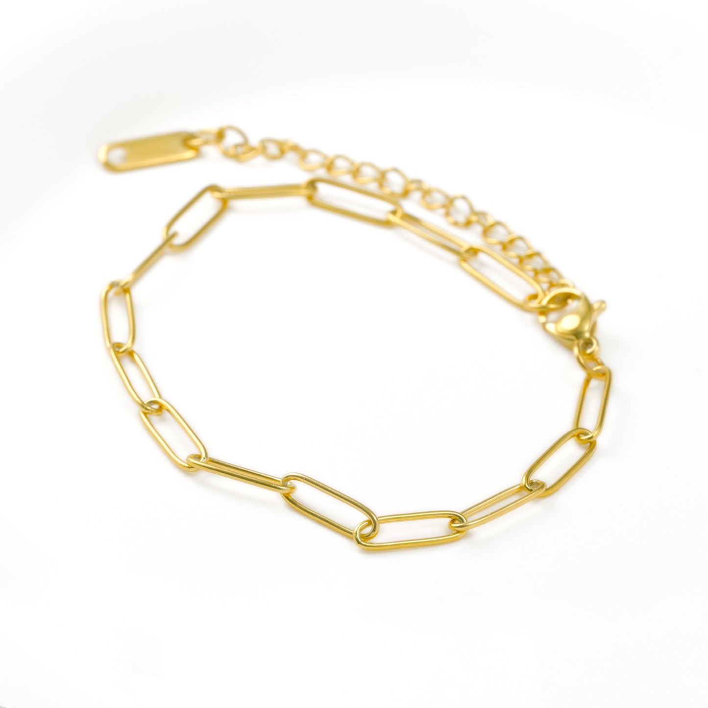 Gold chain bracelet with paperclip links on a white background