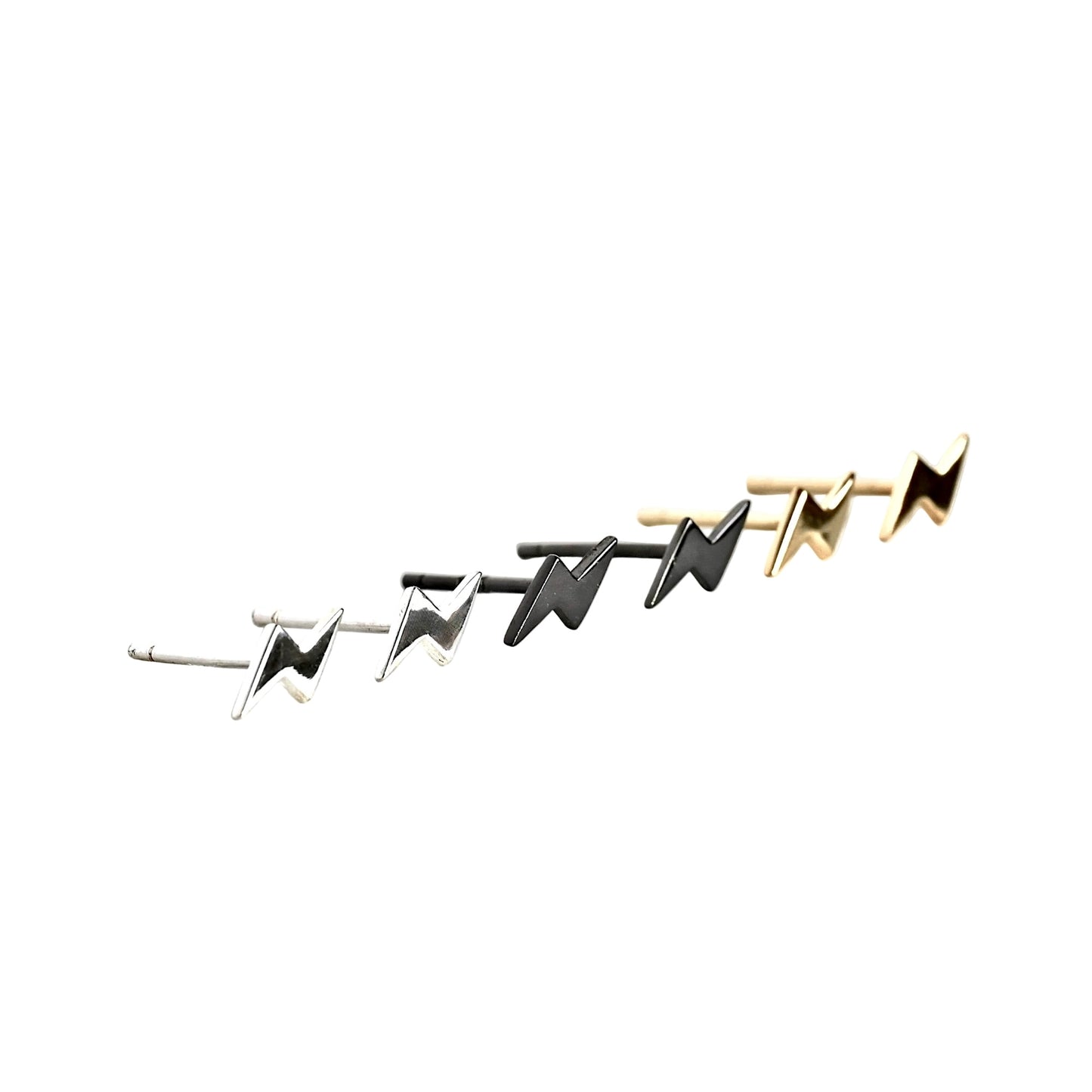 Pairs of gold, silver and black lightning bolt earrings on a white background