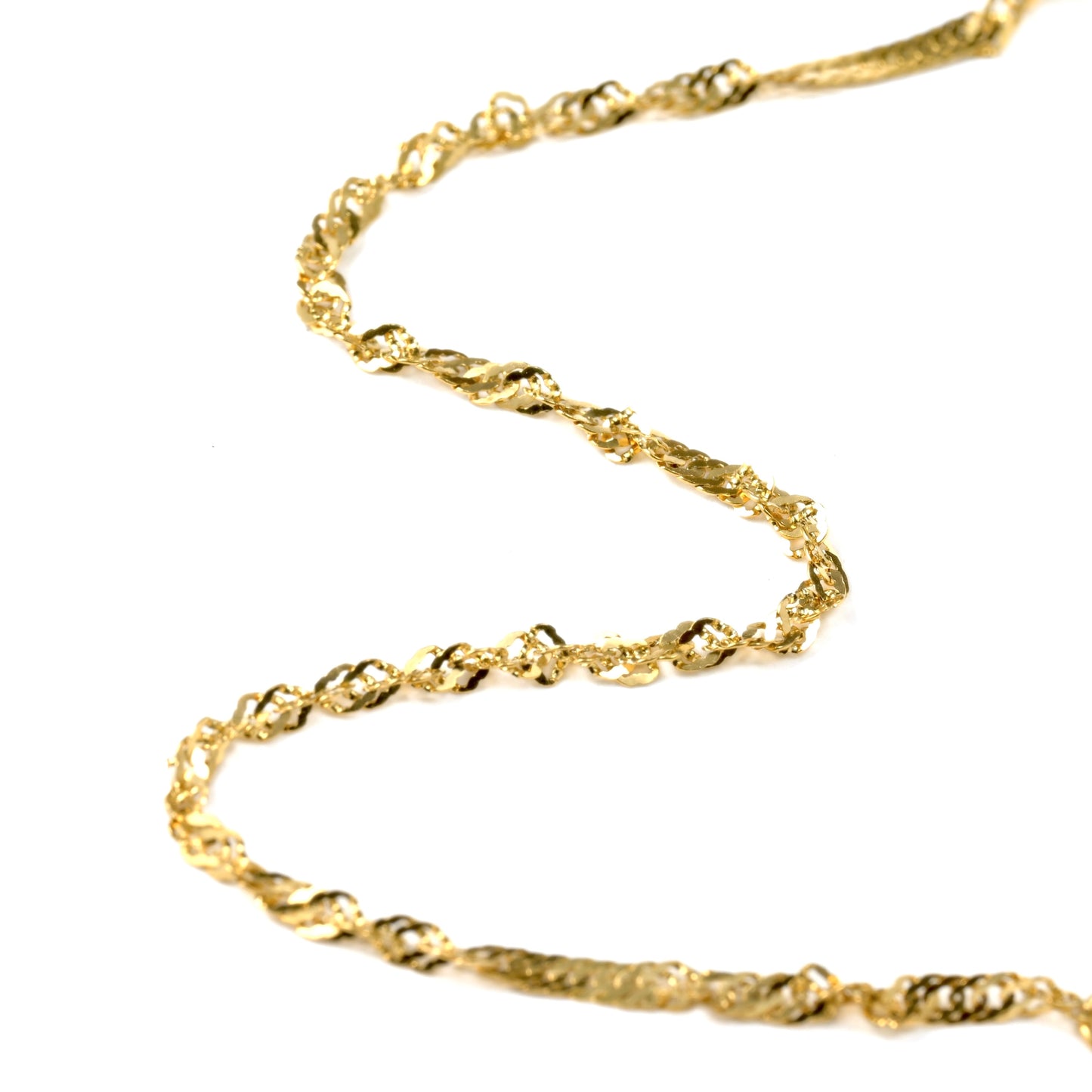 close up view of Gold singapore chain on a white background