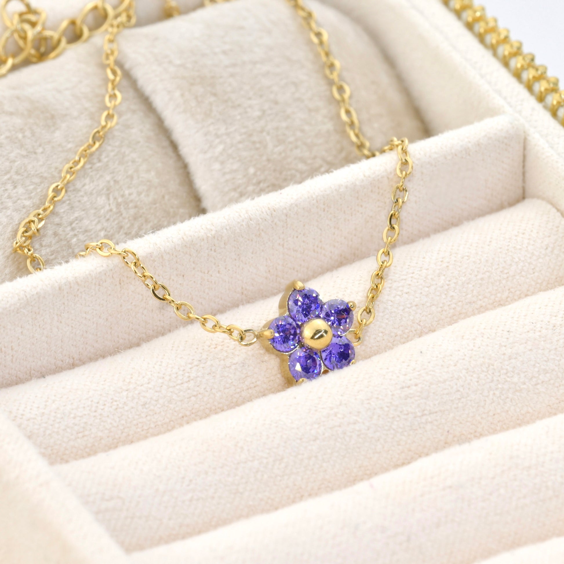 amethyst flower bracelet on a beige surface