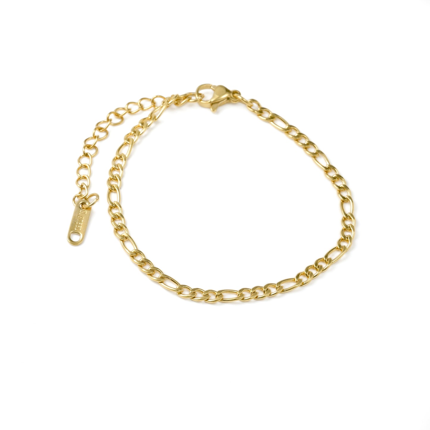 Top view of gold figaro bracelet on a white background