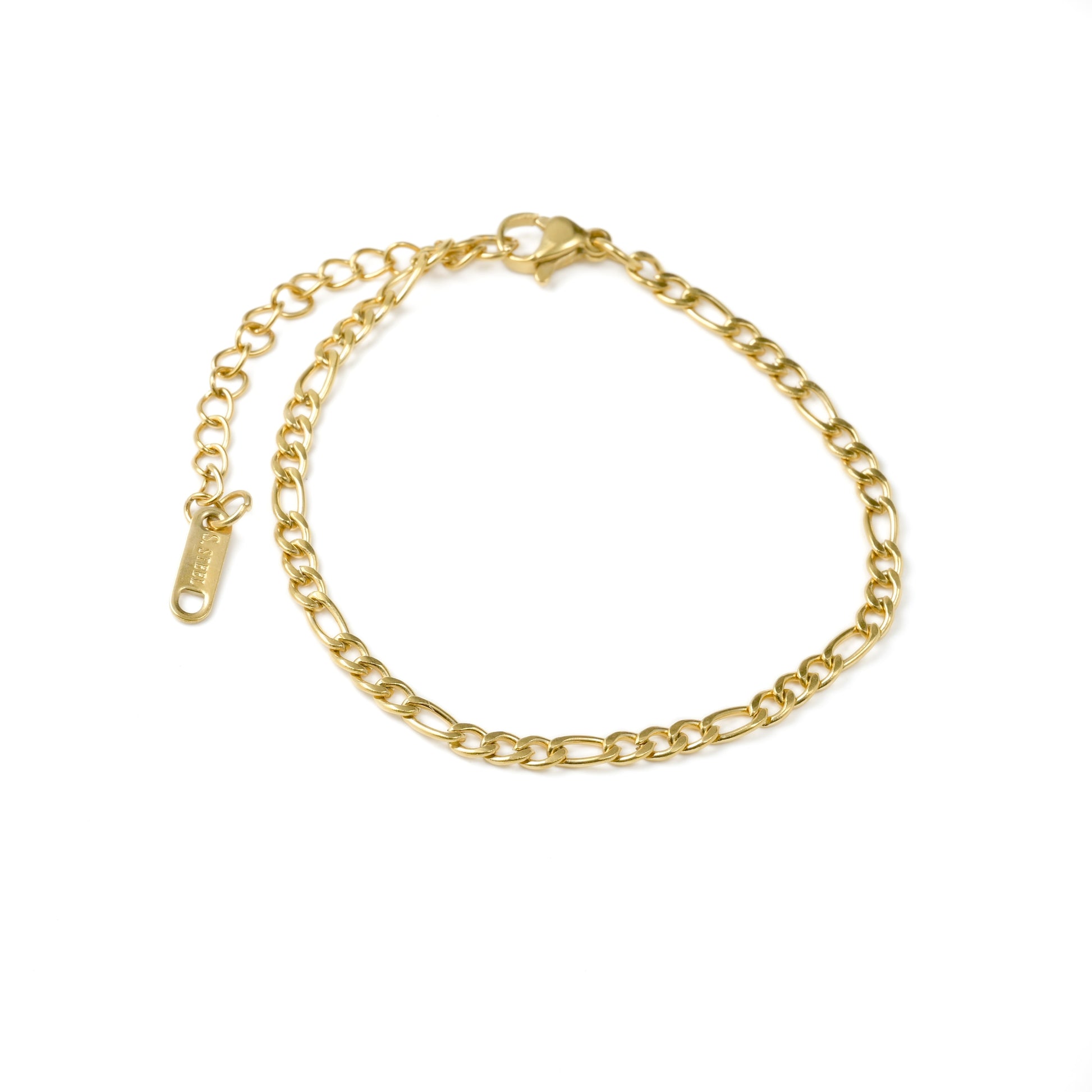 Top view of gold figaro bracelet on a white background