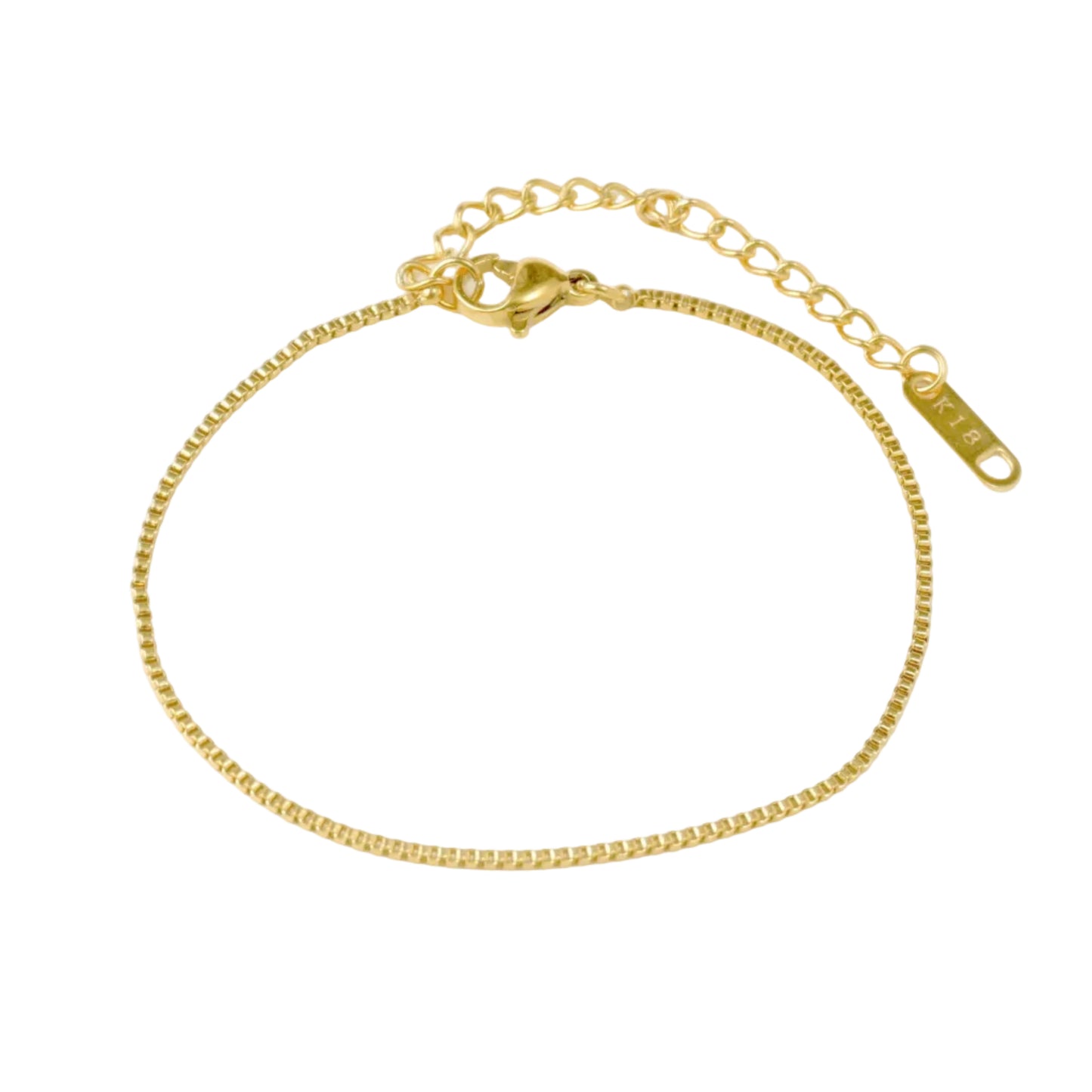 Top view of thin gold box chain bracelet with a lobster claw clasp, extender and a 'K18' plating stamped tag on a white background