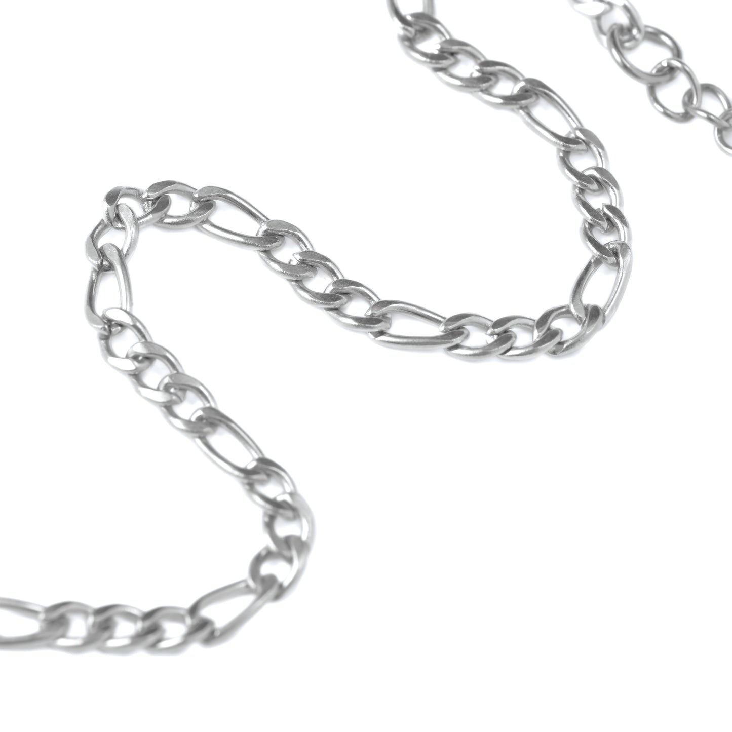 Close-up of Silver figaro chain on a white background
