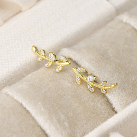gold olive branch stud earrings, leafs adorned with marquise cubic zirconia