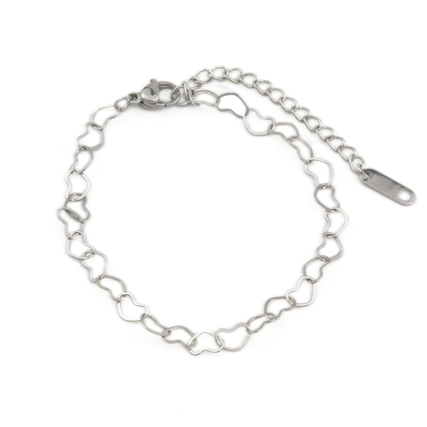 Silver heart-shaped link chain bracelet on a white background with a lobster claw clasp and 'stainless steel' hallmark tag at the end