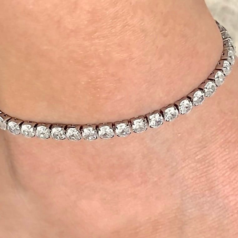 Close-up of a diamond anklet on a person's ankle