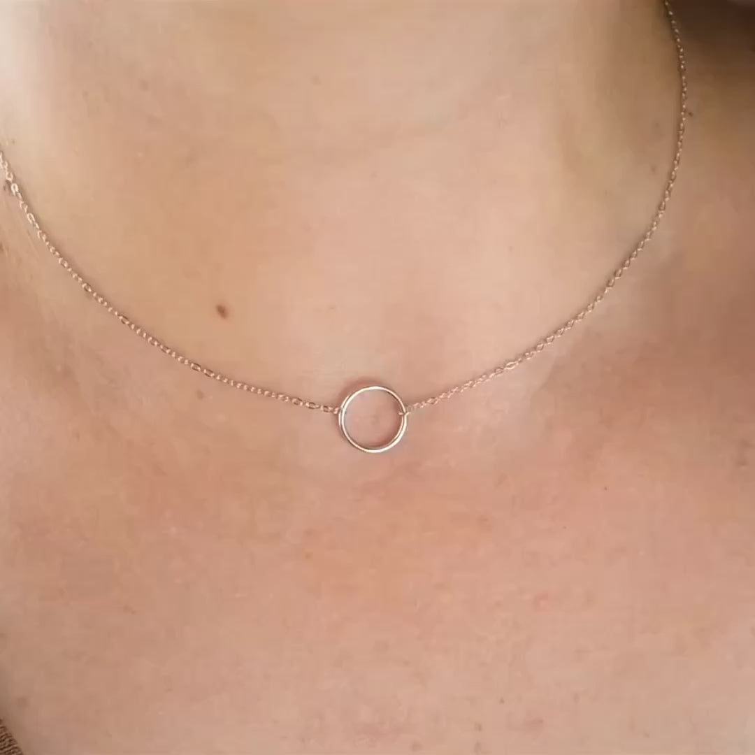 Hollow Circle Necklace just over the collar bone with the ring sparkling as the women turns and the pendant catches the light.