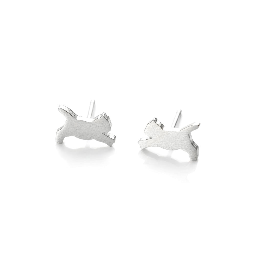 Silver  pouncing cat earrings on a white background