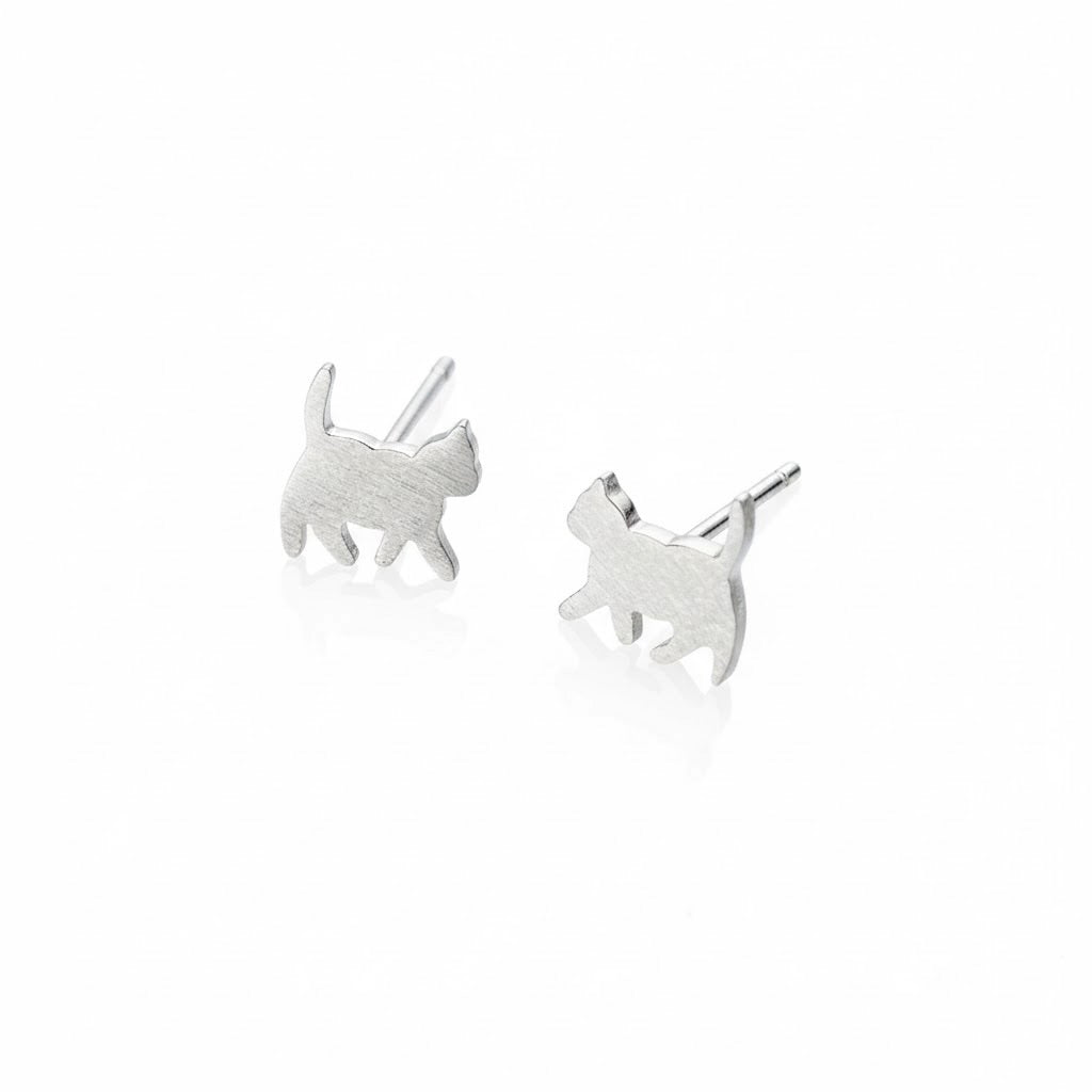 Close-up view of silver cat stud earrings with a brushed finish, on a white background