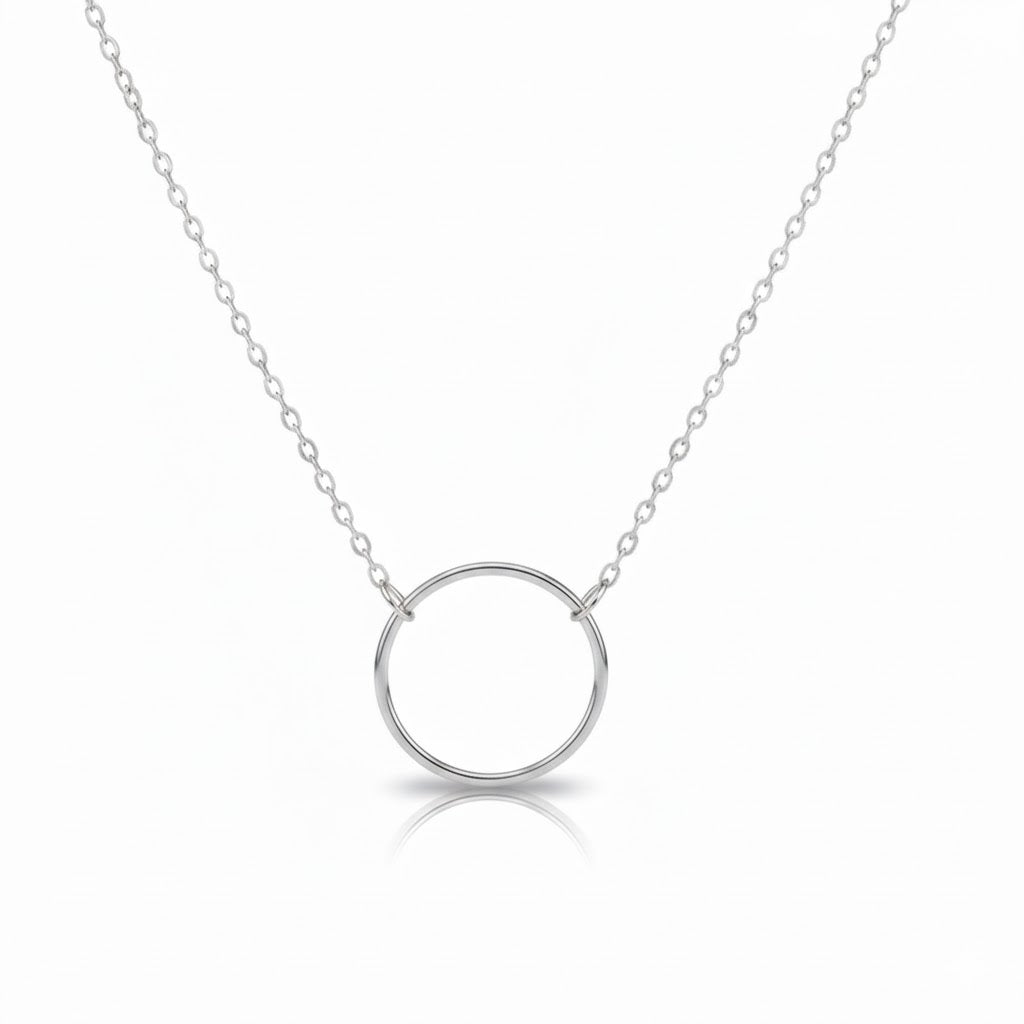 Silver circle pendant necklace on a white background