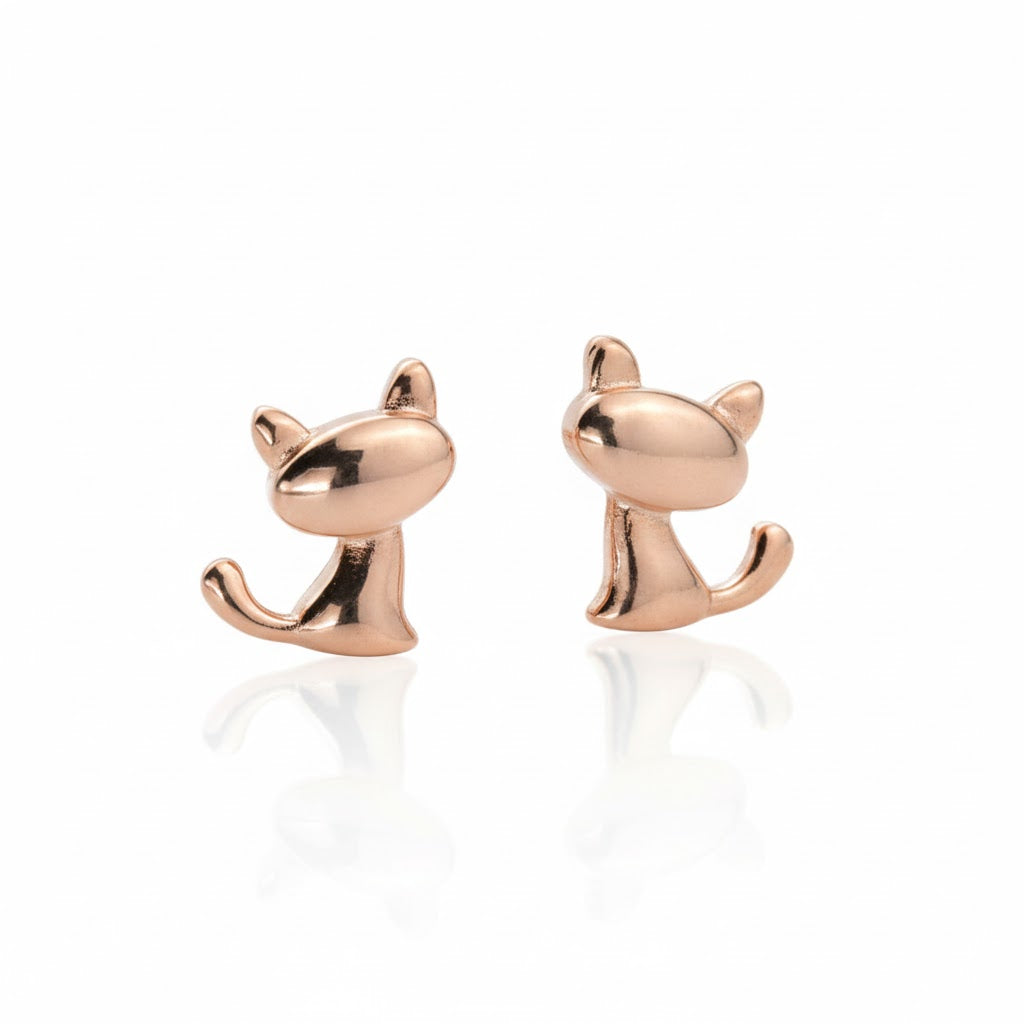 Rose gold kitten stud earrings on a white background