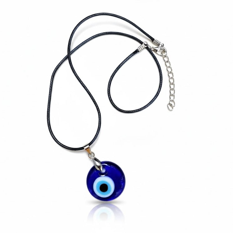 Necklace with a blue glass evil eye medallion and black rope on a white background