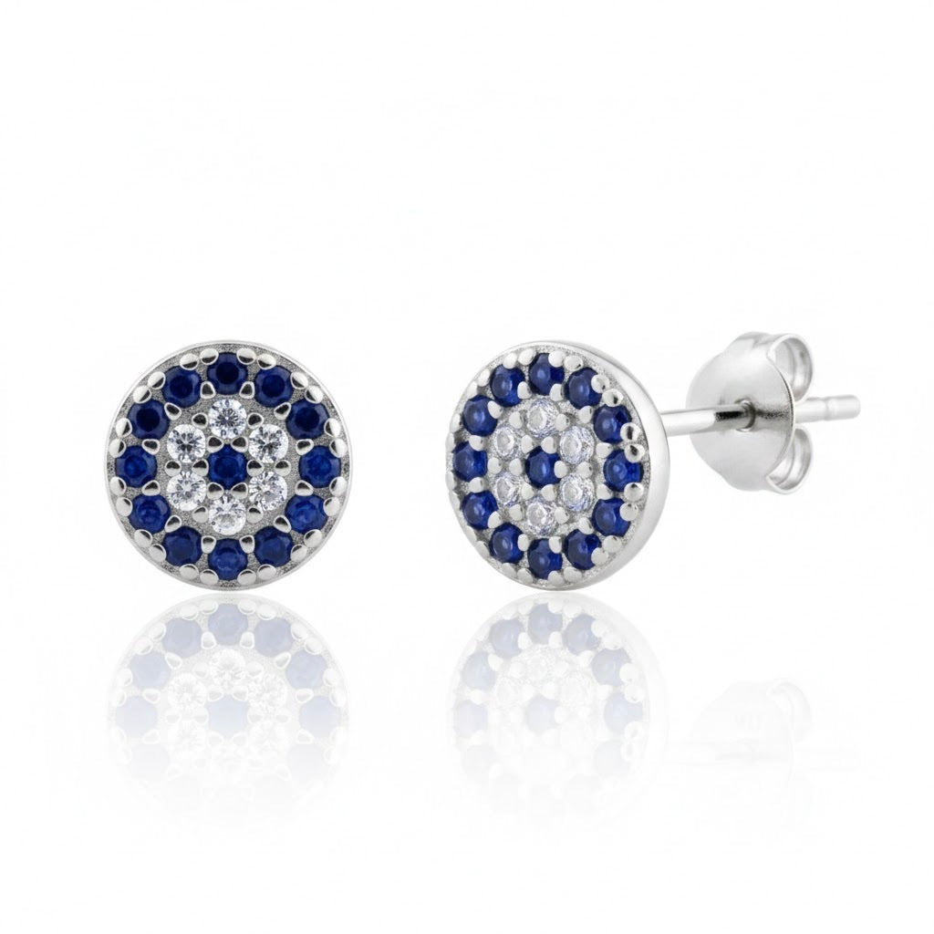 Pair of silver earrings with blue and clear gemstones on a white background