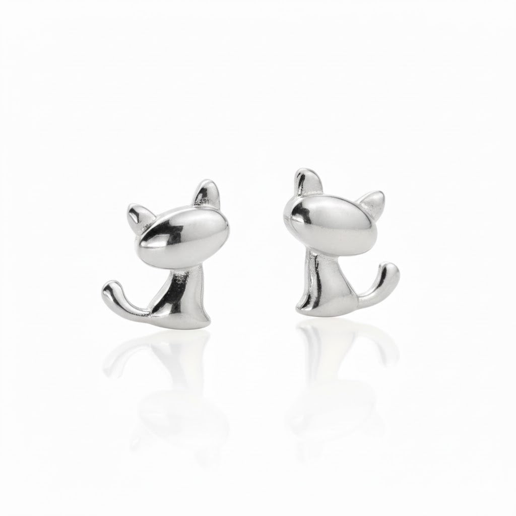 Front view of silver cat-shaped earrings on a white background