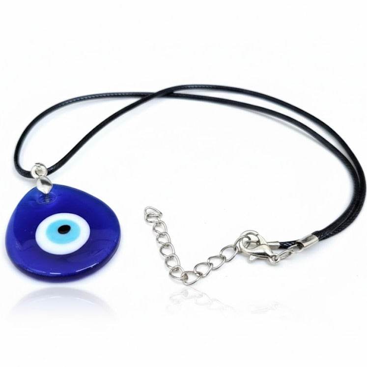 Necklace with a  teardrop shaped blue evil eye pendant on a white background