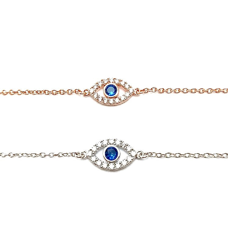 Rose gold and silver eye bracelets with blue and clear gemstones on a white background