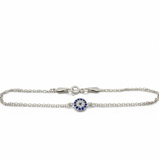 Silver  tiny evil eye bracelet with a blue and clear CZ stones on a white background
