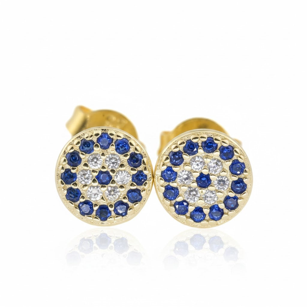 Gold eye earrings with blue and white gemstones on a white background
