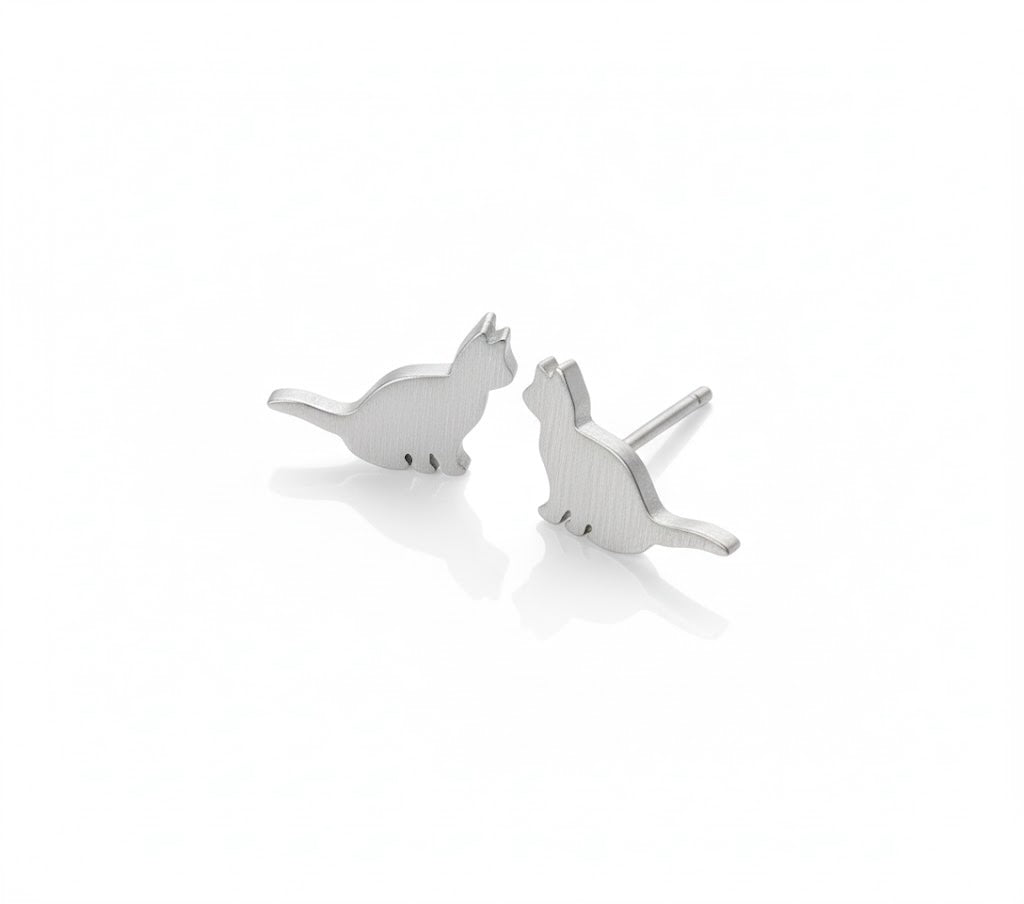 Silver sitting cat earrings on a white background