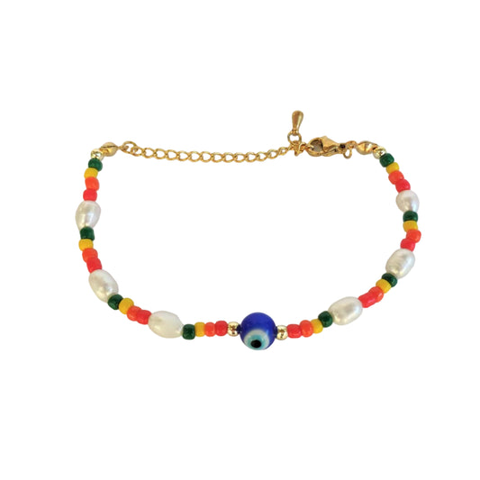 Beaded bracelet with colorful beads , freshwater pearls and a blue eye bead, and  a gold clasp on a light gray background
